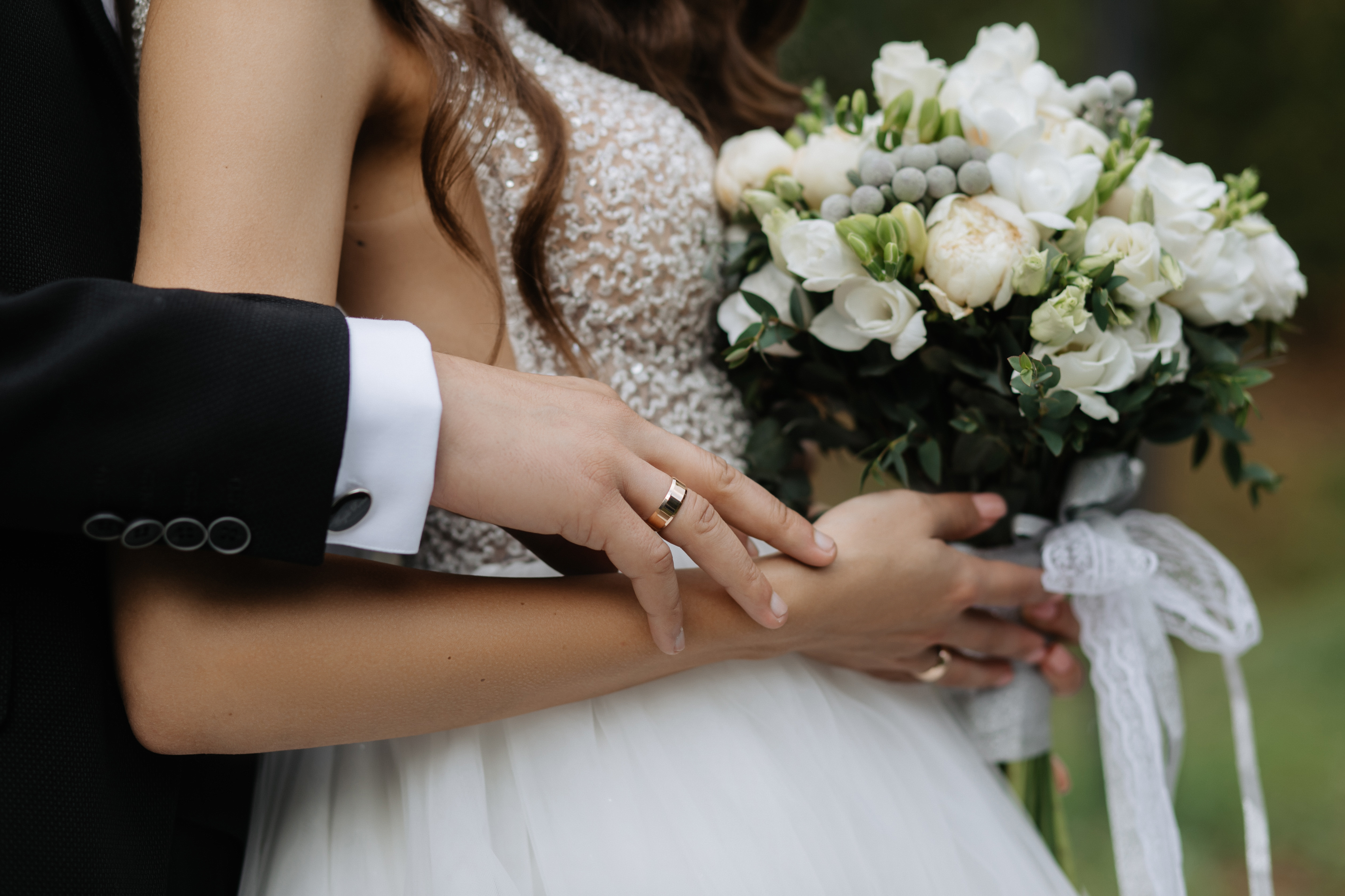 Bride Holds Beautiful Bouquet Groom Hugs Her Back